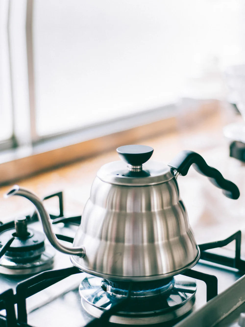 hario buono kettle on stove for pourover specialty coffee brewing