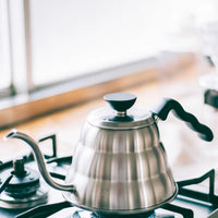 hario buono kettle on stove for pourover specialty coffee brewing